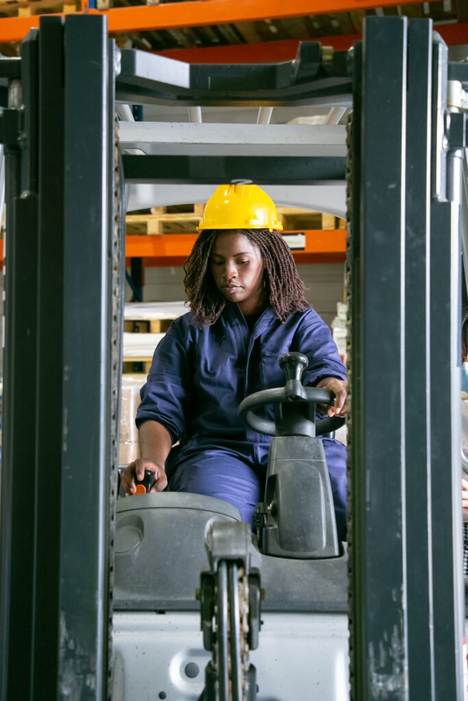 focused young black female logistic worker in hardhat